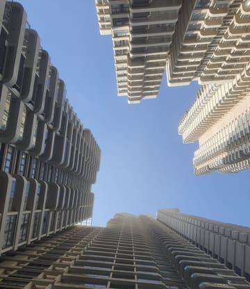 Towers with sculpted balconies, seen from below